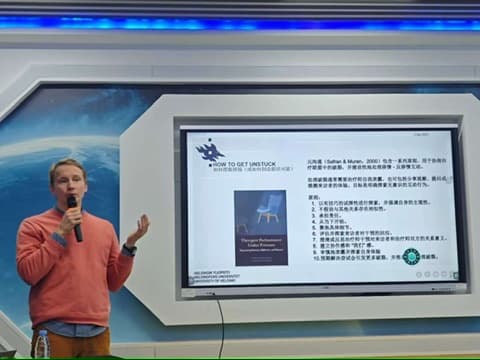 Sami Kivikkokangas presenting research findings during a training session
