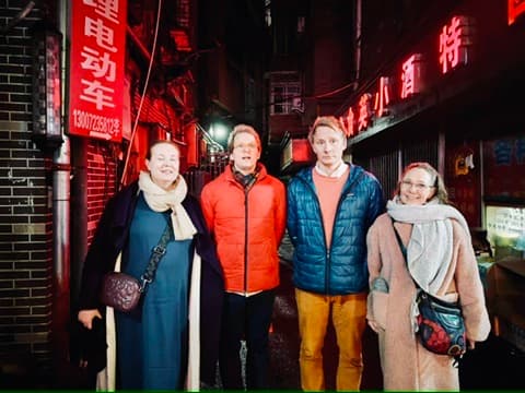 Finnish and Chinese colleagues walking together on a Nanchang street